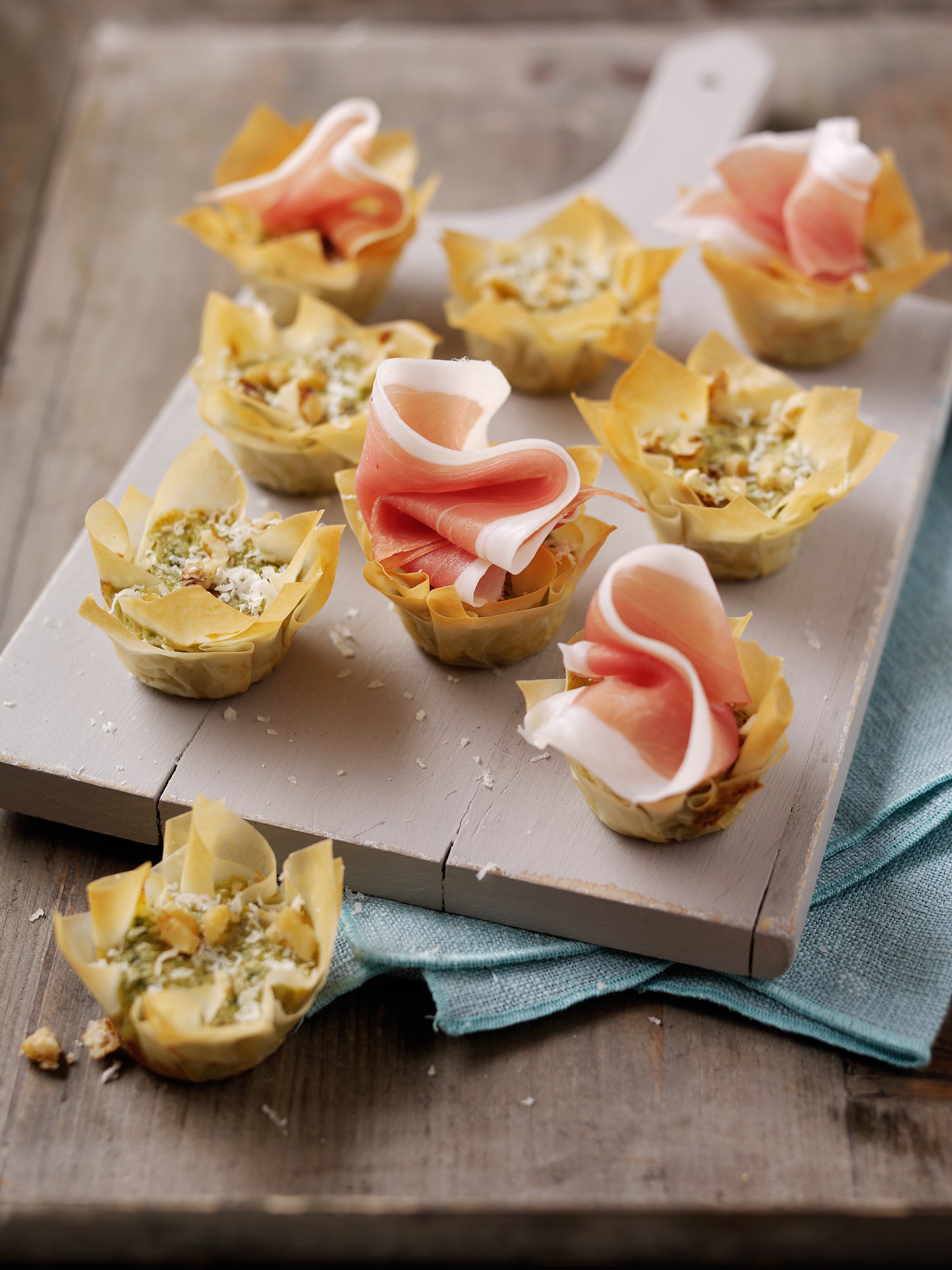 Basil ricotta and walnut Parma Ham cocktail quiches