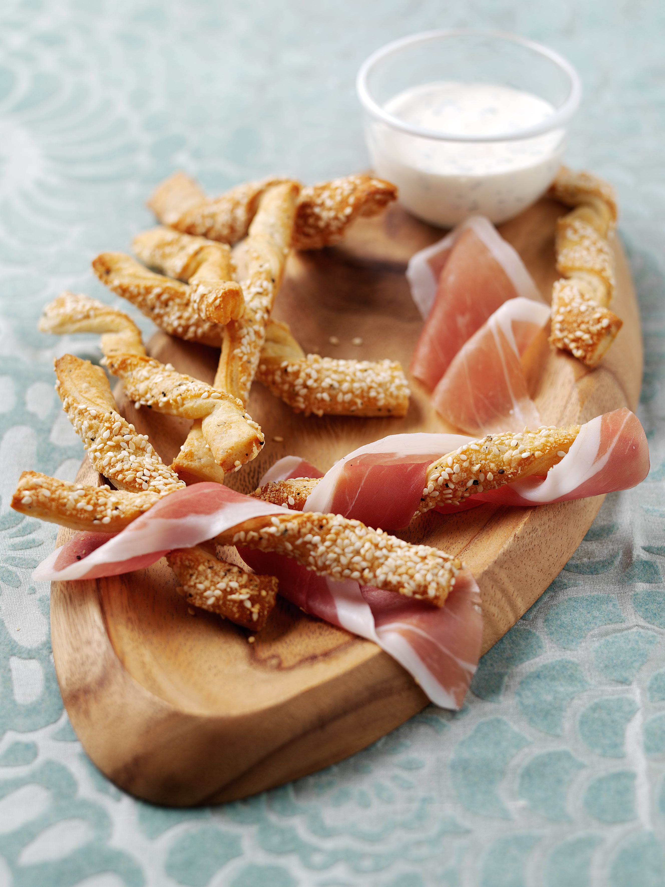Parmesan cheese straws wrapped in Parma Ham with cream cheese